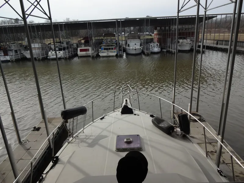 Slide: The Image of 1989 Hi-Star AFT Cabin Sundeck Motor Yacht docked at a marina. - 15