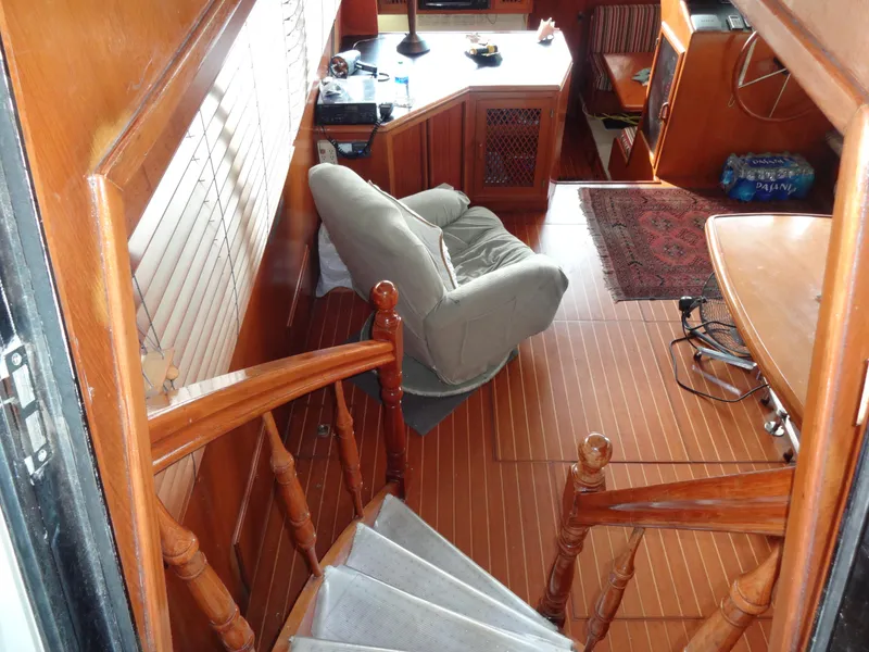 Slide: The Image of Interior of 1989 Hi-Star AFT Cabin Sundeck Motor Yacht with wooden flooring and seating. - 17