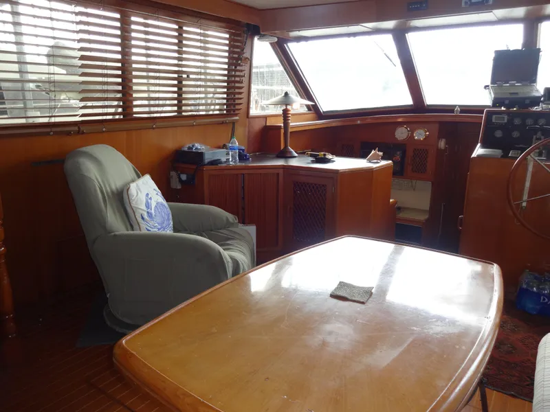 Slide: The Image of Interior of 1989 Hi-Star AFT Cabin Sundeck Motor Yacht with wooden furnishings and seating. - 22