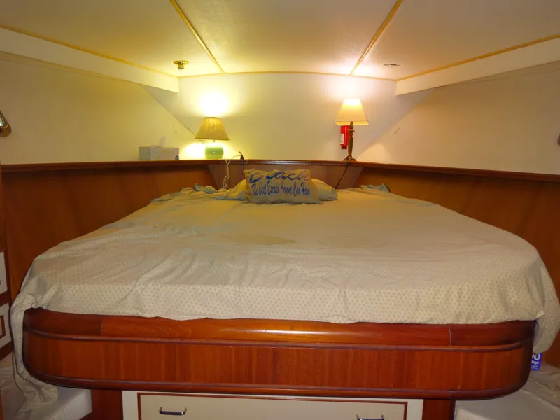 Slide: The Image of Cozy bedroom in 1989 Hi-Star AFT Cabin Sundeck Motor Yacht with warm lighting. - 29