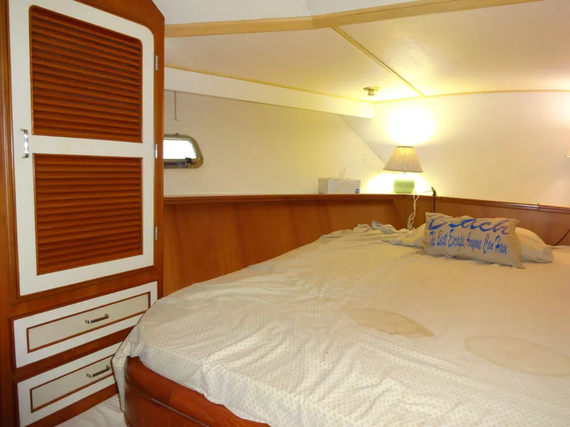 Slide: The Image of Cozy bedroom in 1989 Hi-Star AFT Cabin Sundeck Motor Yacht with wooden accents. - 31