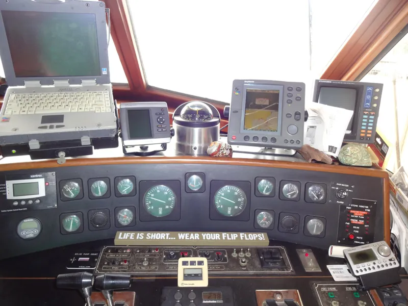 Slide: The Image of Control panel of a 1989 Hi-Star AFT Cabin Sundeck Motor Yacht with navigation equipment. - 35