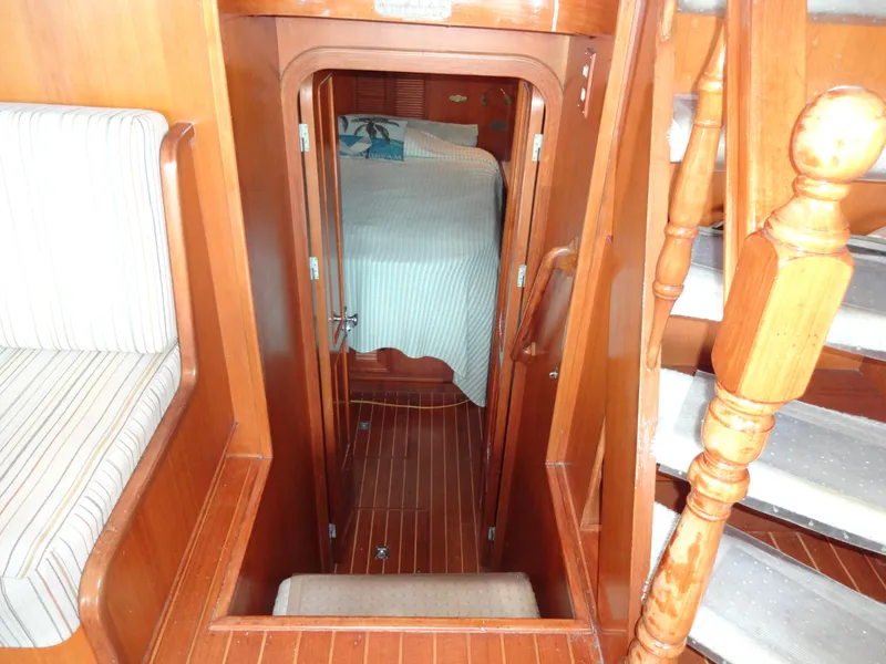 Slide: The Image of Interior of 1989 Hi-Star AFT Cabin Sundeck Motor Yacht with wooden stairs and cozy cabin. - 38