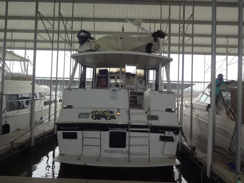 Slide: The Image of 1989 Hi-Star AFT Cabin Sundeck Motor Yacht docked in marina. - 4
