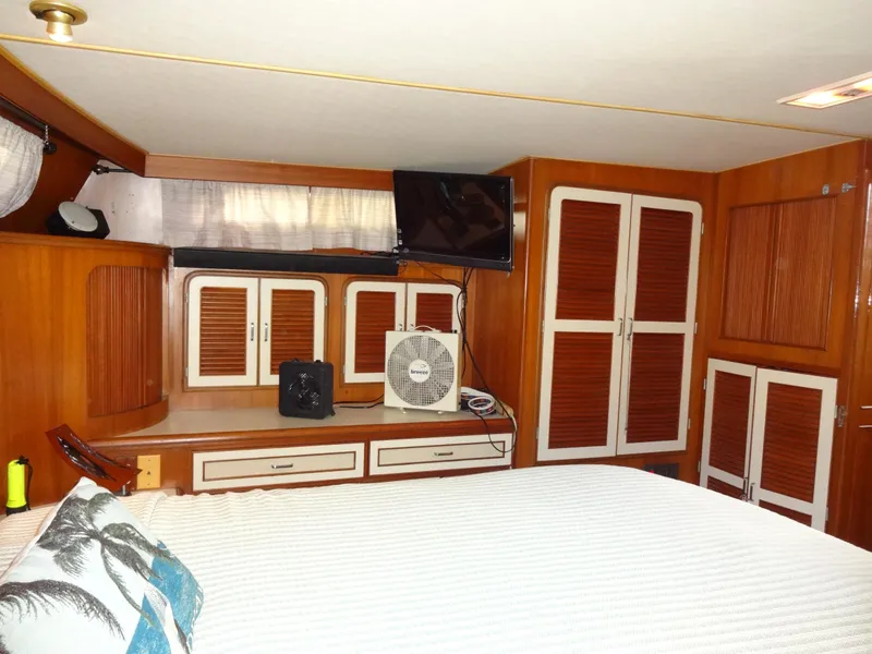 Slide: The Image of 1989 Hi-Star AFT Cabin Sundeck Motor Yacht interior with wood paneling and modern amenities. - 41