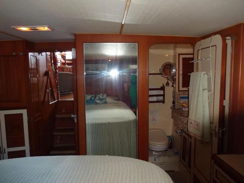 Slide: The Image of Interior of 1989 Hi-Star AFT Cabin Sundeck Motor Yacht with cozy bedroom and bathroom. - 42