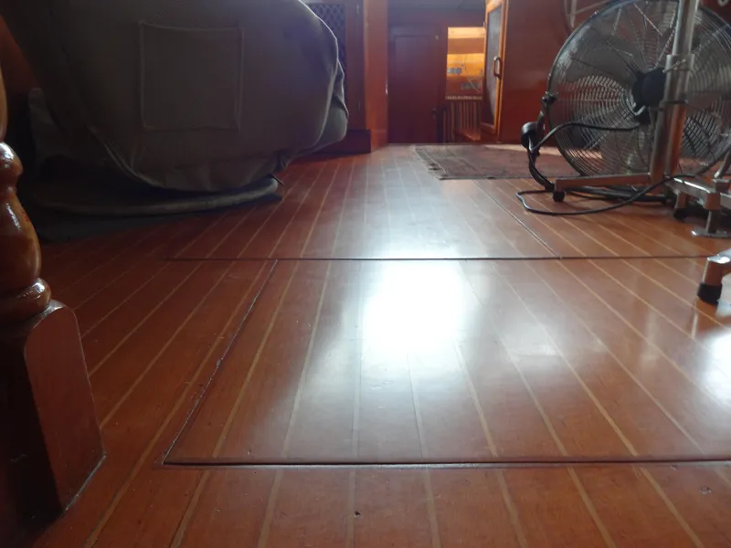 Slide: The Image of Interior of 1989 Hi-Star AFT Cabin Sundeck Motor Yacht with wooden flooring and fan. - 48