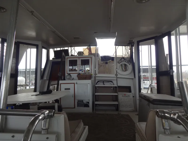 Slide: The Image of Interior view of 1989 Hi-Star AFT Cabin Sundeck Motor Yacht with seating and storage. - 5