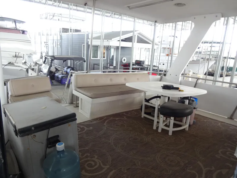 Slide: The Image of 1989 Hi-Star AFT Cabin Sundeck Motor Yacht interior with seating and table. - 6