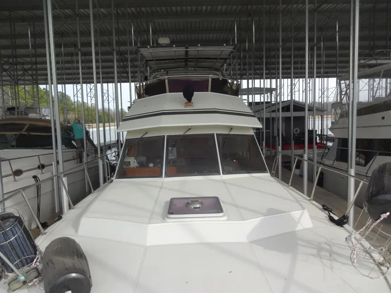Slide: The Image of 1989 Hi-Star AFT Cabin Sundeck Motor Yacht docked in a covered marina. - 9