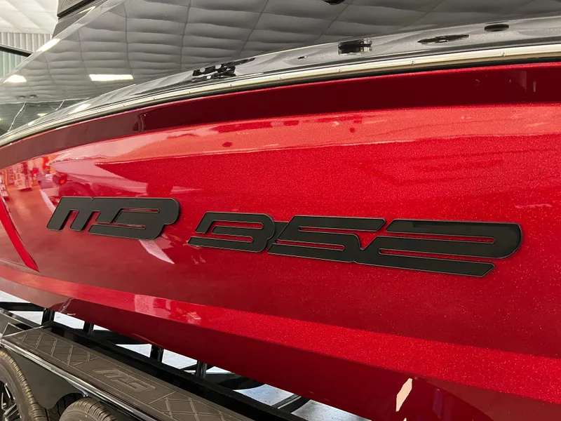 Slide: The Image of Red 2024 MB B52 boat with bold black logo. - 3