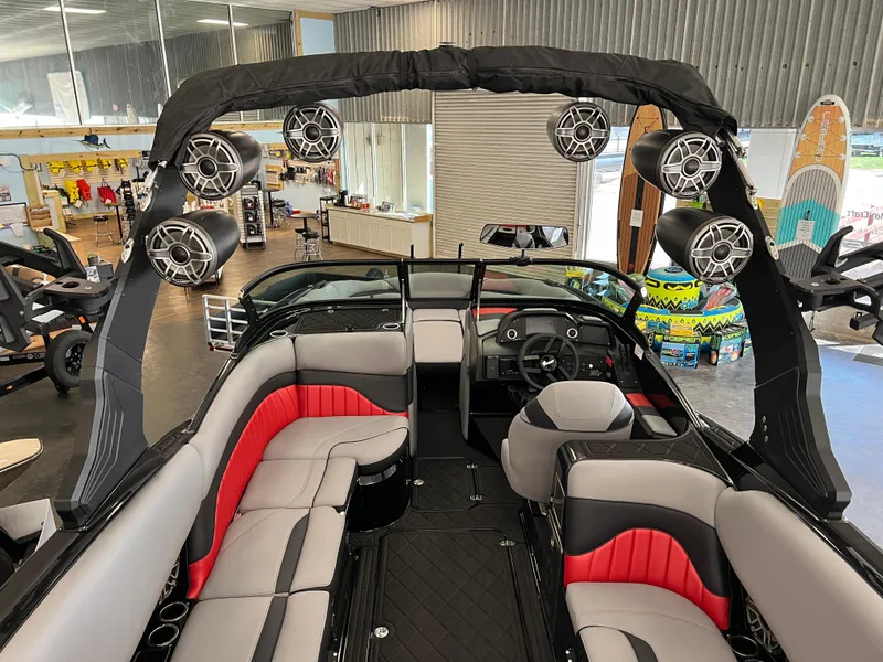 Slide: The Image of 2024 MB B52 boat interior with red and gray seating, advanced sound system, and modern design. - 4