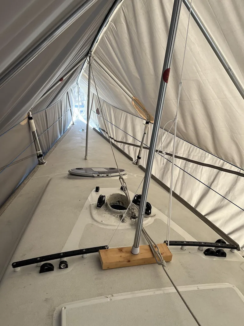 Slide: The Image of 2007 Custom Hallett 33 sailboat under protective cover. - 20