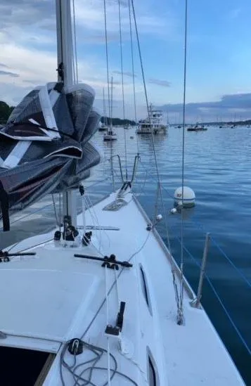 Slide: The Image of 2007 Custom Hallett 33 sailboat docked in a serene marina. - 6