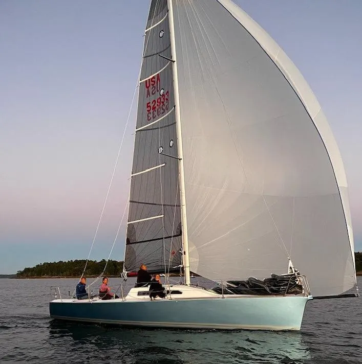 Slide: The Image of 2007 Custom Hallett 33 sailboat cruising on calm waters. - 7