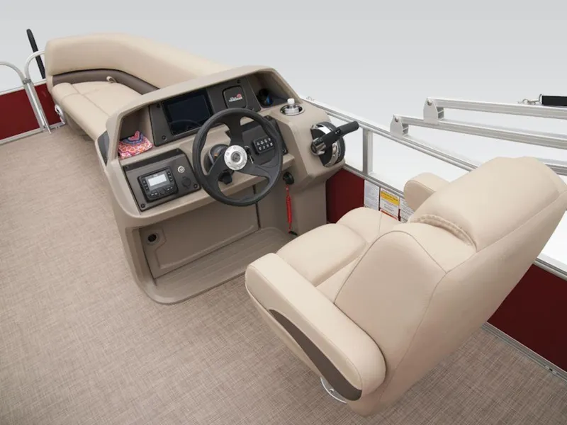 Slide: The Image of 2024 Sun Tracker PARTY BARGE® 18 DLX interior with beige seating and steering console. - 10