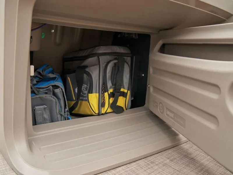 Slide: The Image of Storage compartment of 2024 Sun Tracker PARTY BARGE® 18 DLX with bags inside. - 6