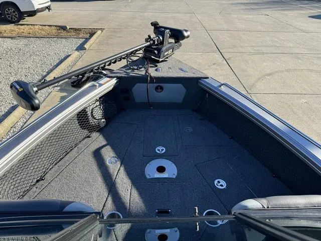 Slide: The Image of 2024 Lund 1975 Tyee Sport boat interior with trolling motor and spacious deck. - 13