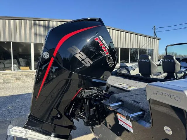 Slide: The Image of 2024 Lund 1975 Tyee Sport boat with Mercury 225 Pro XS outboard motor. - 3