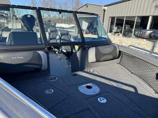 Slide: The Image of 2024 Lund 1975 Tyee Sport boat interior with seating and storage compartments. - 6