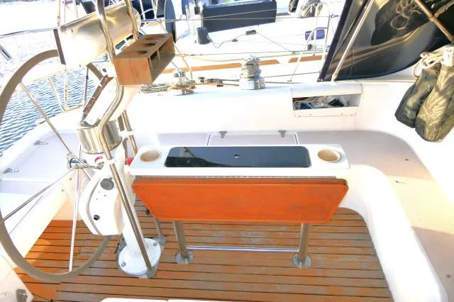 Slide: The Image of Cockpit of 1997 Catalina 380 sailboat with wooden seating and steering wheel. - 20