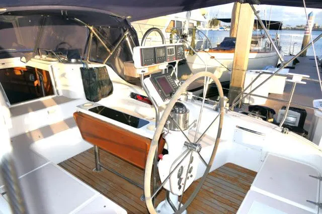 Slide: The Image of Cockpit of a 1997 Catalina 380 sailboat with steering wheel and navigation instruments. - 21