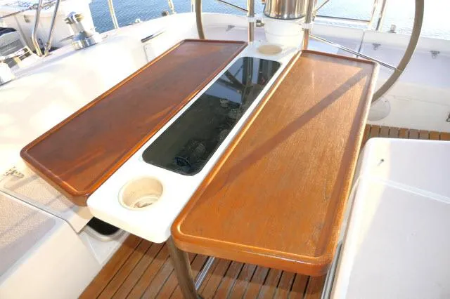 Slide: The Image of Cockpit table on 1997 Catalina 380 sailboat with wooden finish and cup holders. - 24