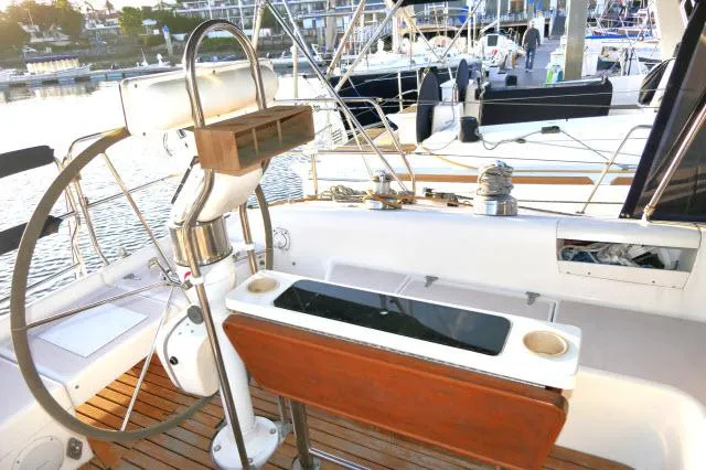 Slide: The Image of Cockpit of a 1997 Catalina 380 sailboat with steering wheel and wooden seating. - 25