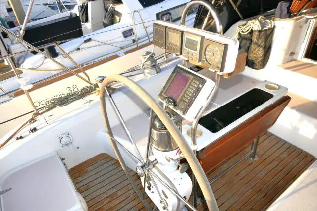 Slide: The Image of Cockpit of a 1997 Catalina 380 sailboat with navigation instruments and steering wheel. - 26