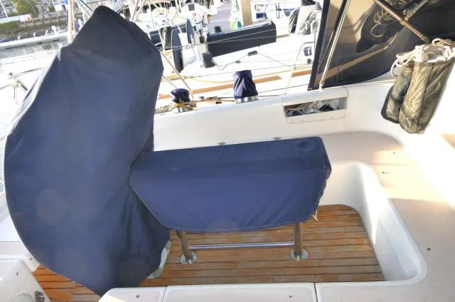 Slide: The Image of Covered cockpit area of a 1997 Catalina 380 sailboat with wooden flooring. - 27