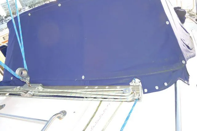 Slide: The Image of Catalina 380 sailboat, 1997 model, featuring blue canvas cover and rigging details. - 32
