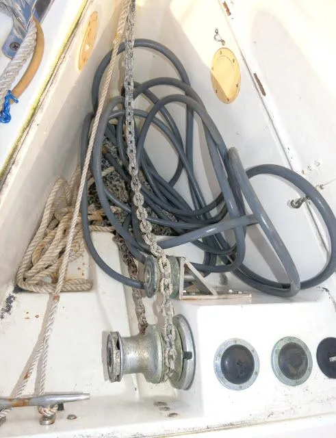 Slide: The Image of Anchor chain and ropes in a 1997 Catalina 380 sailboat's storage compartment. - 40