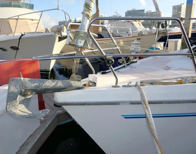 Slide: The Image of Catalina 380 sailboat from 1997 docked with anchor visible. - 41