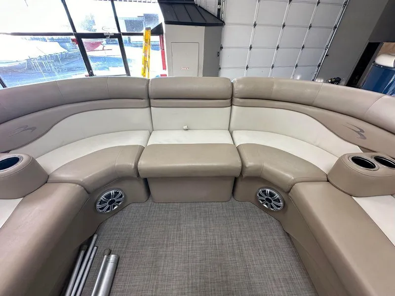 Slide: The Image of Interior seating of a 2016 Bennington 24 SLX pontoon boat with beige upholstery. - 5