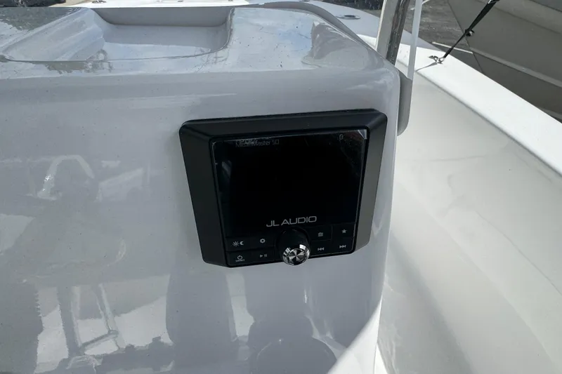 Slide: The Image of 2024 Tidewater 180 CC boat featuring JL Audio system on console. - 12
