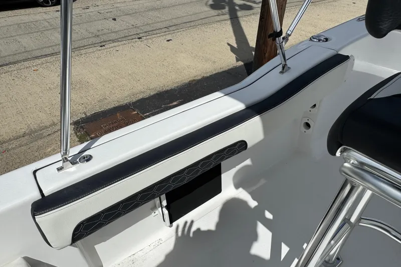 Slide: The Image of 2024 Tidewater 180 CC boat interior with sleek seating and stainless steel details. - 18