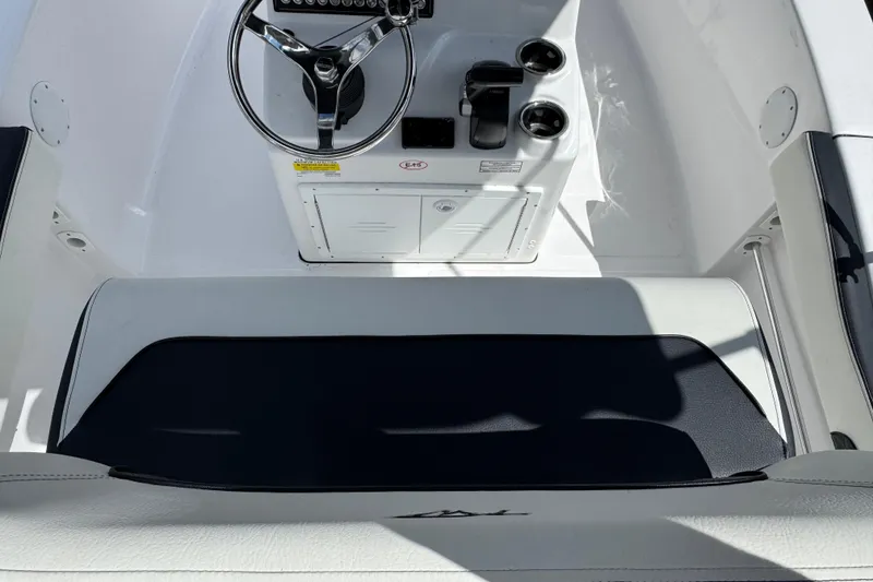 Slide: The Image of 2024 Tidewater 180 CC boat interior with steering wheel and seating area. - 20