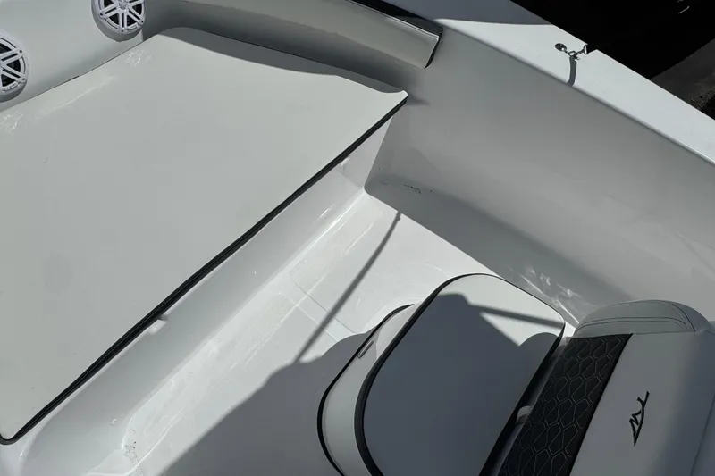 Slide: The Image of 2024 Tidewater 180 CC boat interior with seating and speakers. - 26