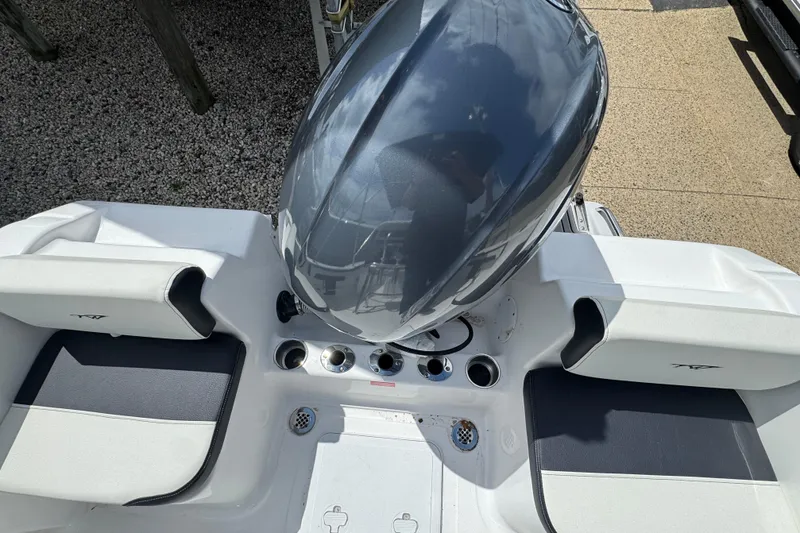 Slide: The Image of 2024 Tidewater 180 CC boat with sleek engine and seating, viewed from above. - 5
