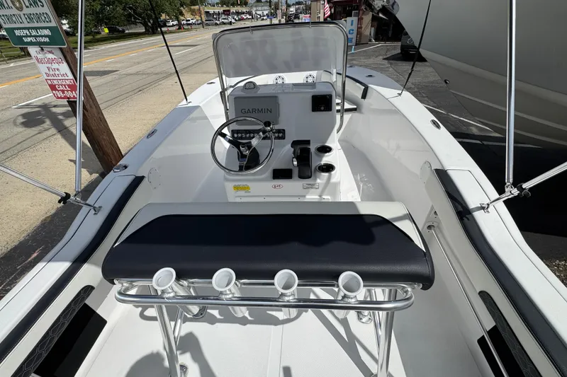 Slide: The Image of 2024 Tidewater 180 CC boat interior with Garmin navigation and rod holders. - 7