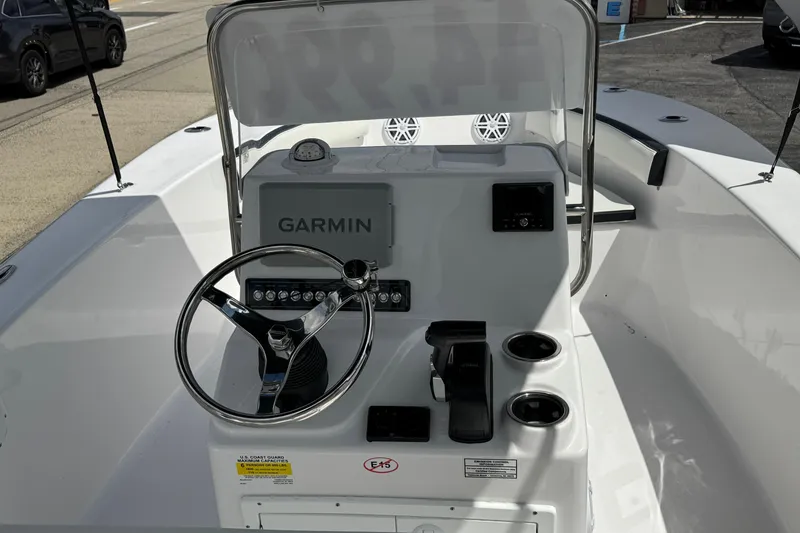 Slide: The Image of 2024 Tidewater 180 CC boat console with Garmin navigation system and steering wheel. - 8