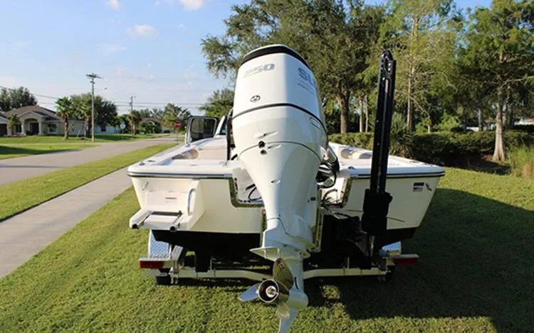 Slide: The Image of 2023 Sea Born FX22 Bay boat on a trailer, rear view. - 2