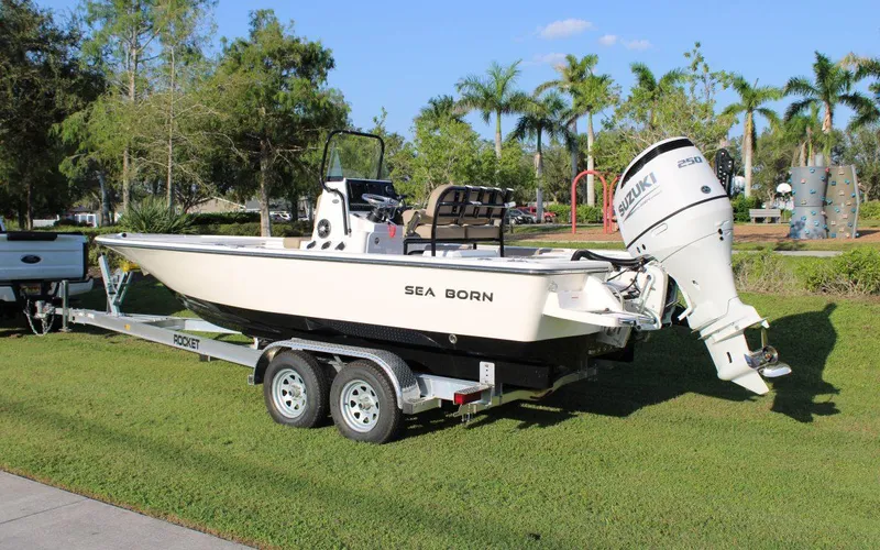 Slide: The Image of 2023 Sea Born FX22 Bay boat on trailer with Suzuki outboard motor. - 6