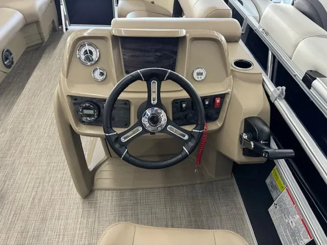 Slide: The Image of 2024 Starcraft LX 18 R boat dashboard with steering wheel and control panel. - 10