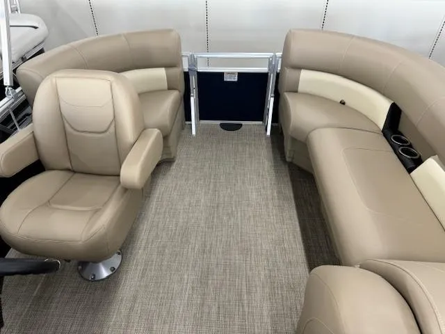 Slide: The Image of Interior seating of 2024 Starcraft LX 18 R pontoon boat with beige upholstery. - 12