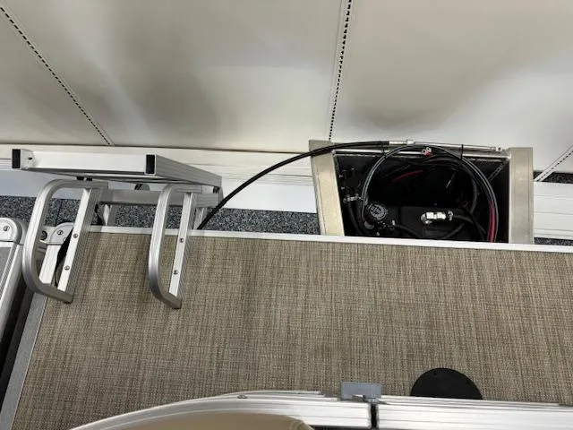 Slide: The Image of 2024 Starcraft LX 18 R boat deck with ladder and engine compartment. - 14