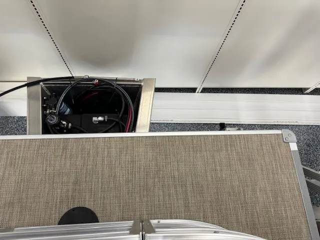 Slide: The Image of Top view of 2024 Starcraft LX 18 R boat interior with storage compartment. - 15