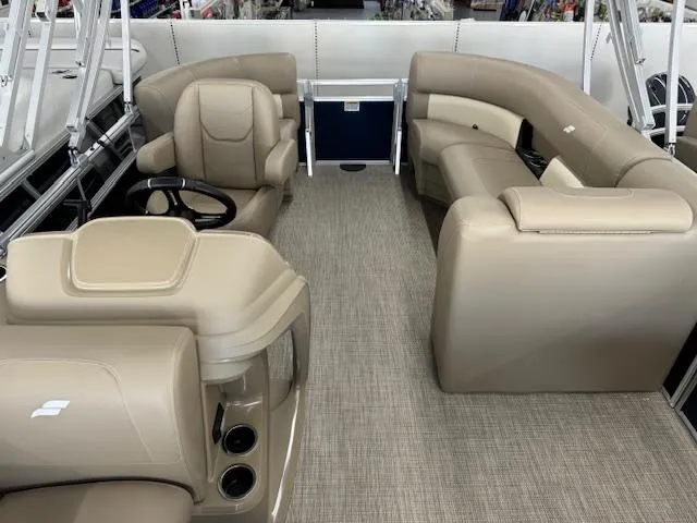 Slide: The Image of 2024 Starcraft LX 18 R pontoon boat interior with beige seating and modern design. - 8