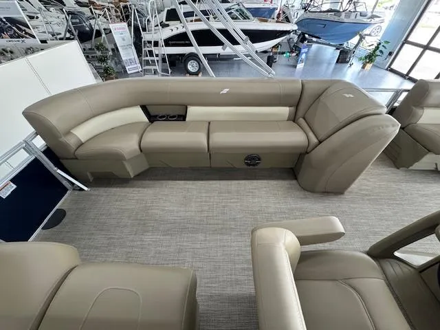 Slide: The Image of 2024 Starcraft LX 20 R boat interior with beige seating and modern design. - 12
