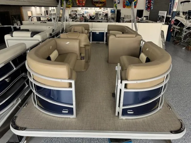 Slide: The Image of 2024 Starcraft LX 20 R pontoon boat with beige seating and spacious deck. - 3